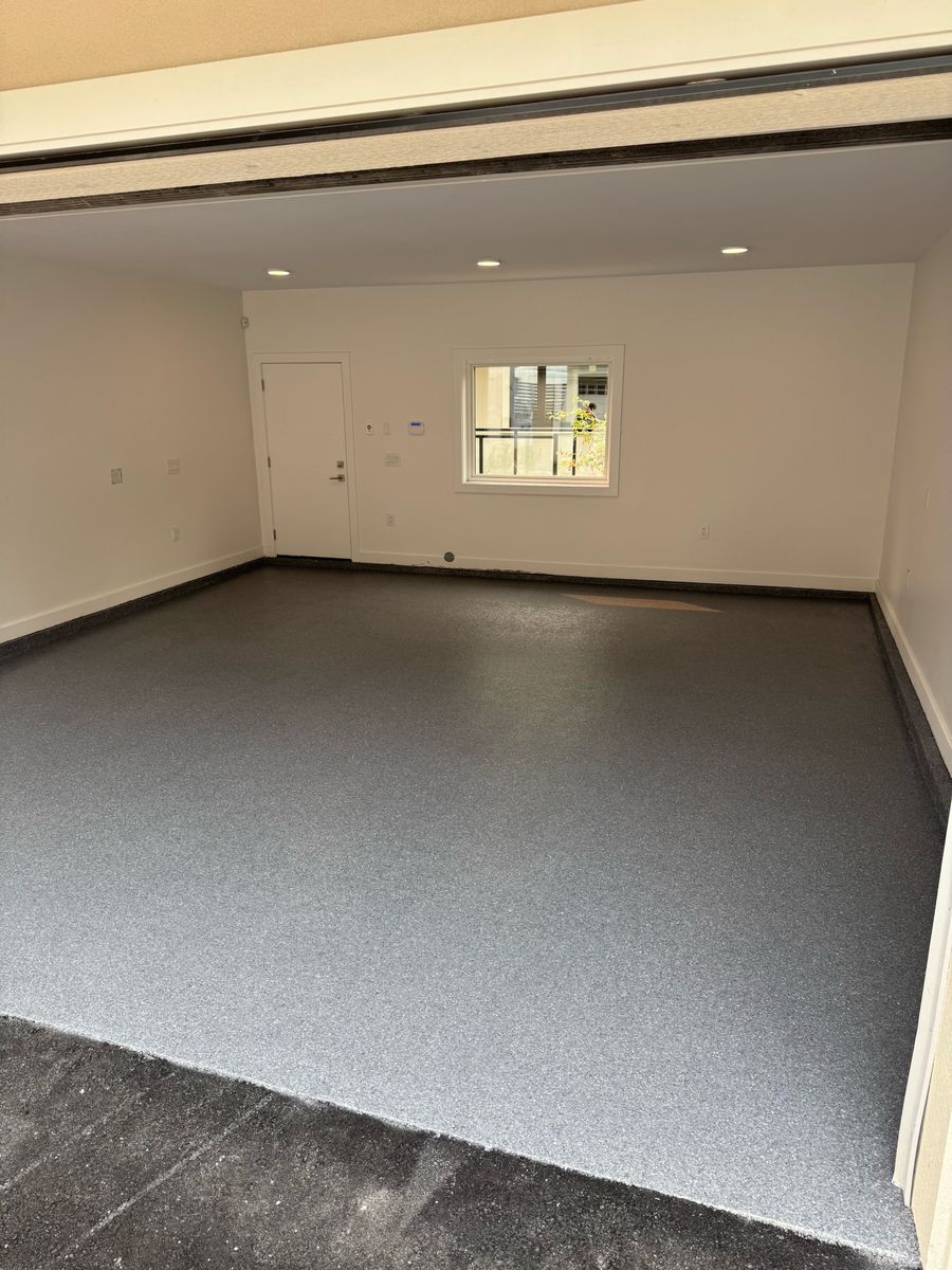 Residential garage with dark grey flake epoxy floor in Maple Ridge BC